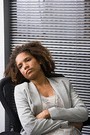 african american woman sitting in chair, not feeling well