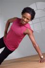 Woman doing side stomach exercise. 