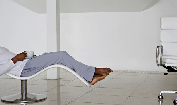 A man relaxing in a chair in his living room