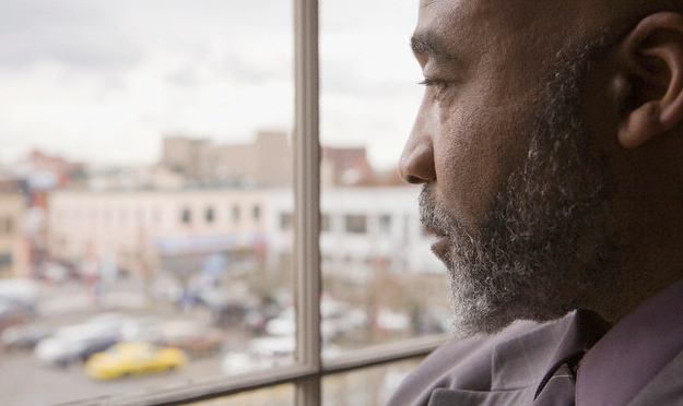 A man looking out of a window