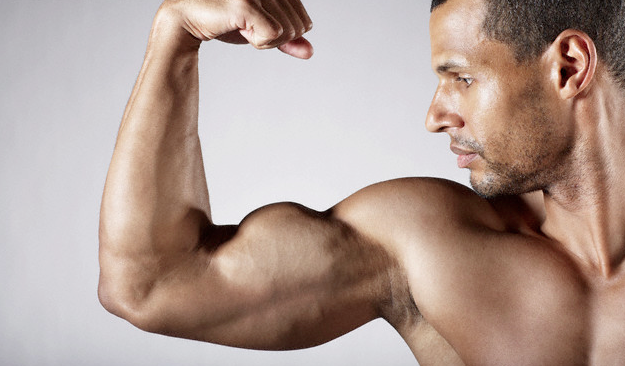 man flexing bicep
