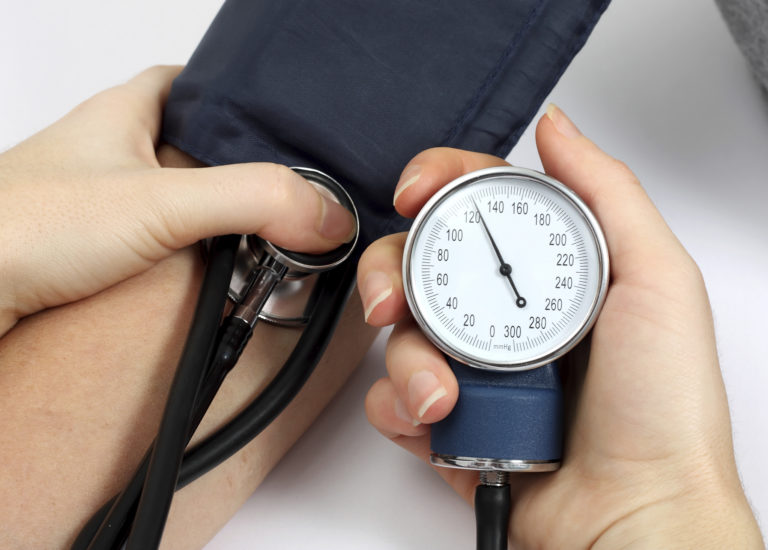 doctor measuring blood pressure