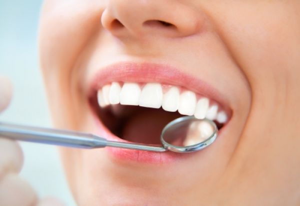 woman getting her teeth looked at