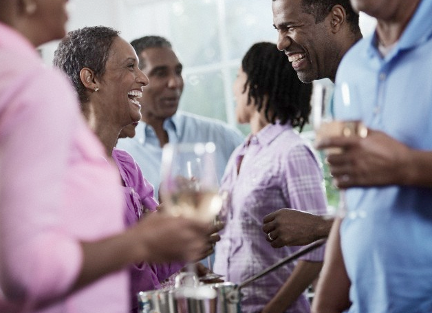 A group of people talking at a casual event
