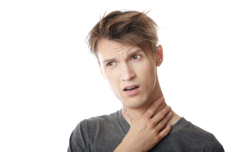 white man suffering from the pain in his throat
