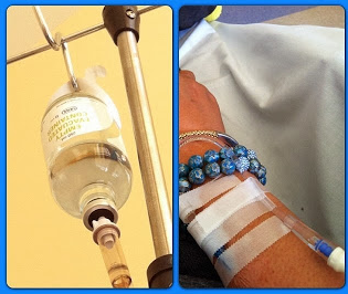 Rae Lewis-Thornton with IV and wearing a blue bracelet