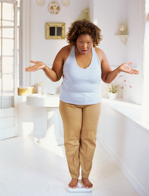 overweight african american woman scale
