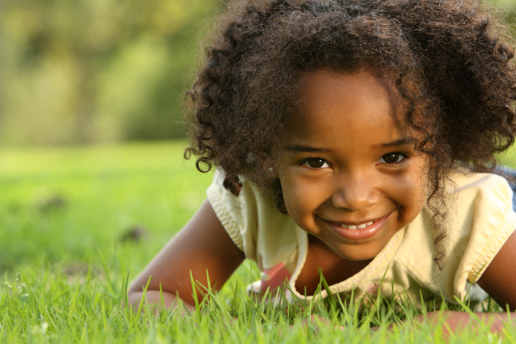african american girl in the grass