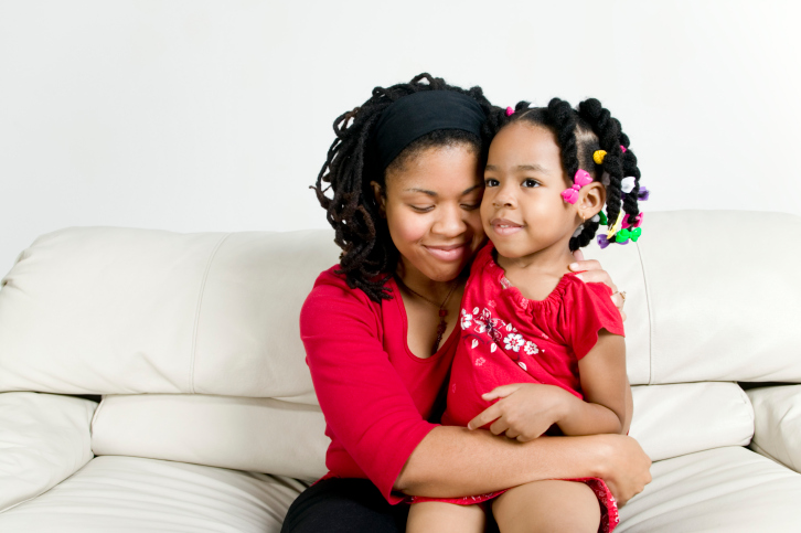 mother hugging daughter