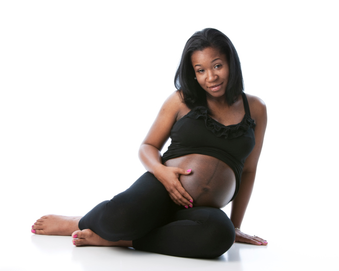 pregnant woman holding belly