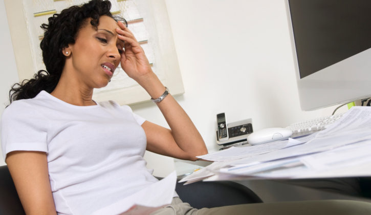 worried woman doing finances