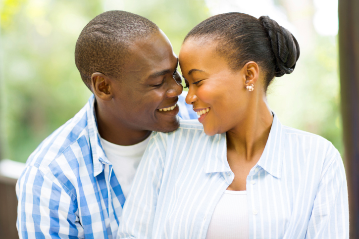 young african american couple looking at each other