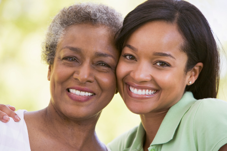 mother and daughter smiling