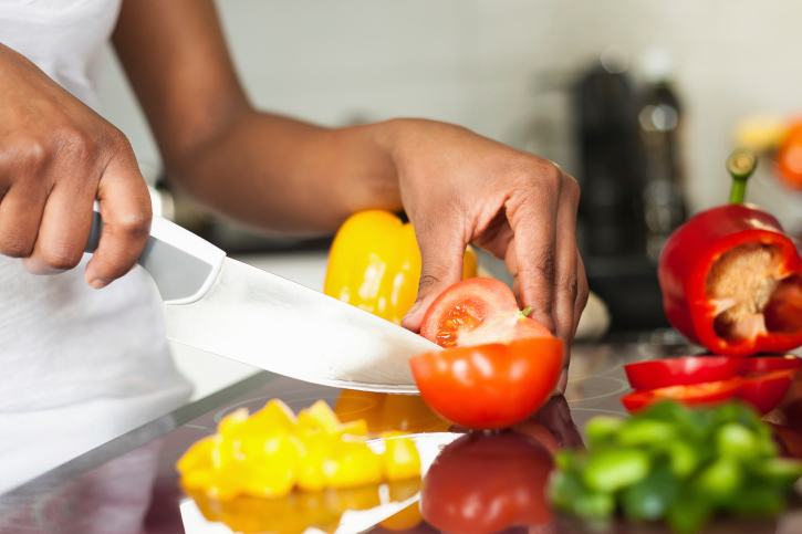 woman cutting vegetables