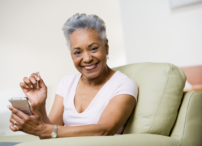 senior african american woman holding organizer