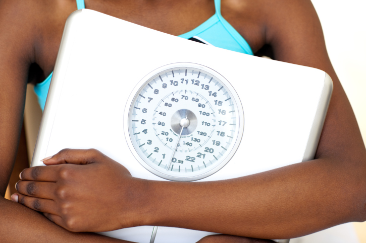 woman holding scale