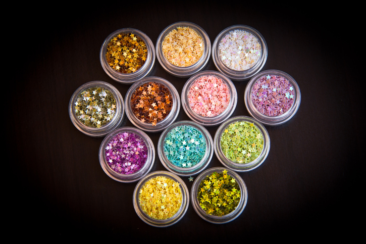 set of glitter in plastic containers