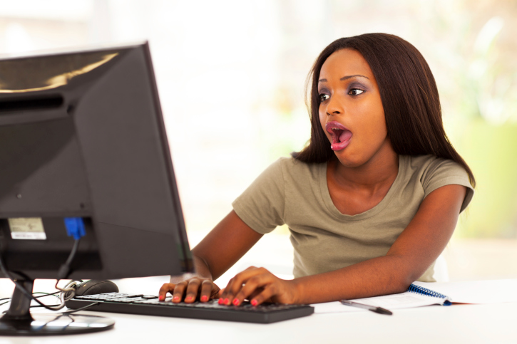 cute african young woman using instant message