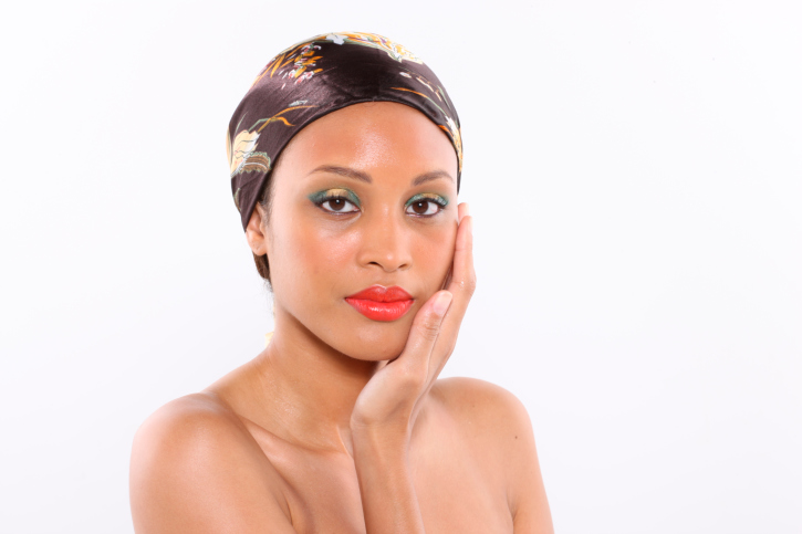 head shot of african american woman wearing head scarf