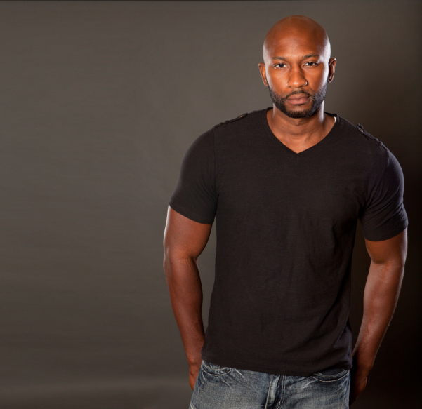 Handsome, athletic black man casually posing