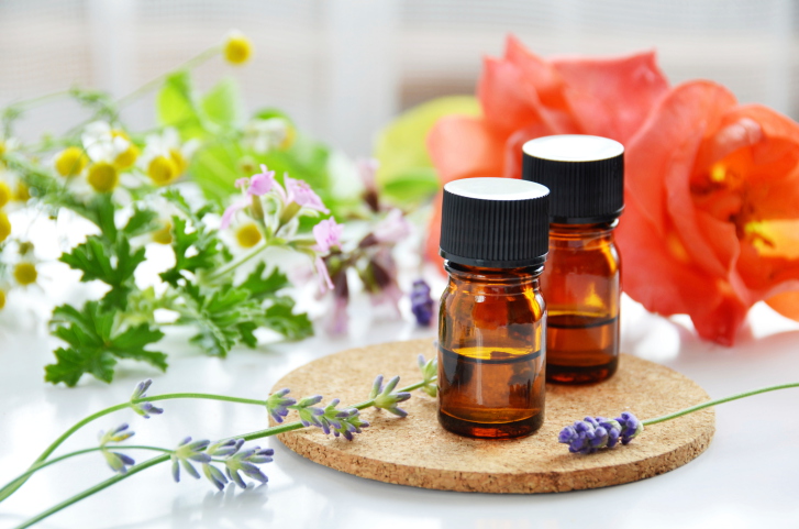 essential oils with herbal flowers
