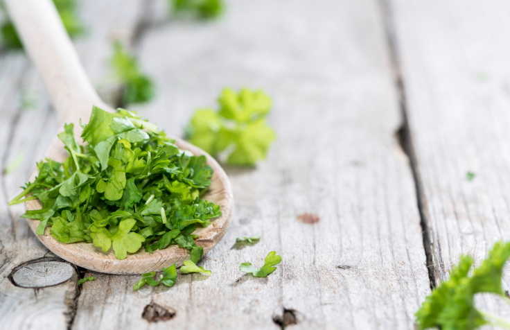 Parsley on a wooden spoon