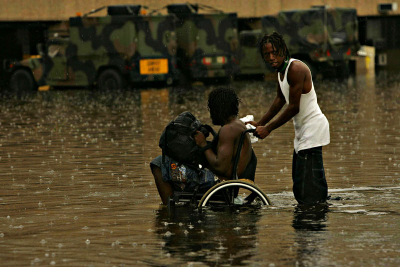 "Katrina Aftermath" Evacuees try to get to the Superdome in New Orleans in the aftermath of Hurricane Katrina on Thursday, September 1, 2005, several days after the levees broke and the city was flooded.