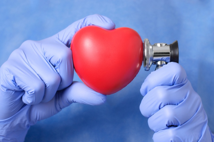 doctor holding stethoscope to heart decal