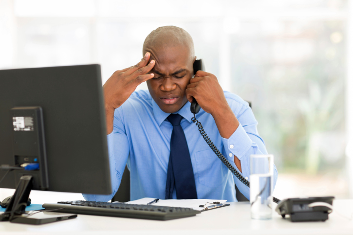 stressed businessman on phone