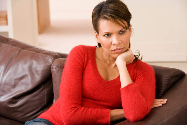 woman sitting on couch