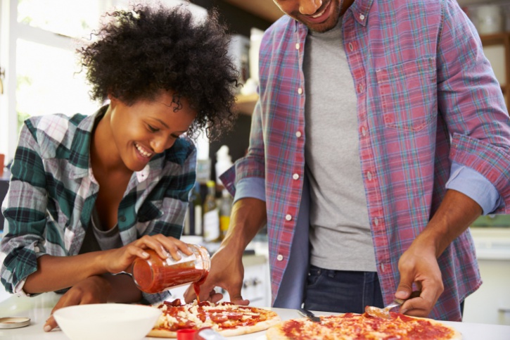 couple making pizza