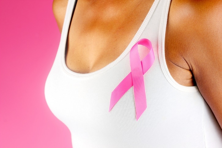 woman in tank top pink ribbon