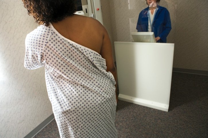 woman getting mammogram