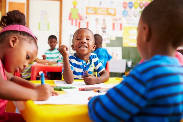 African American black boys and girl in preschool classroom