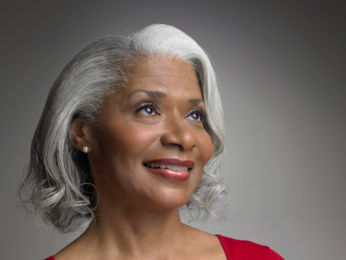 Older African American Black woman with gray hair smiling