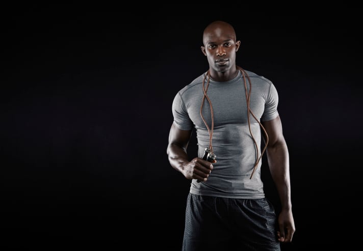 muscular African American man with jump rope