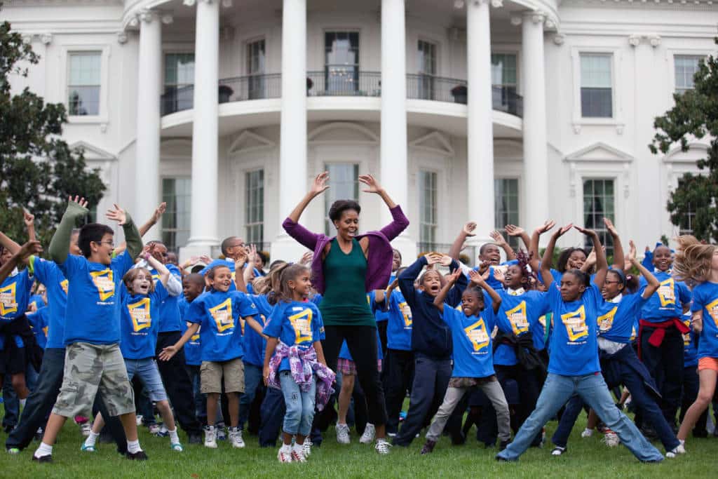 First Lady Michelle Obama leads a group of 400 local children on the South Lawn of the White House to help break the Guinness World Records title for the most people doing jumping jacks in a 24-hour period, Oct. 11, 2011. (Official White House Photo by Chuck Kennedy)