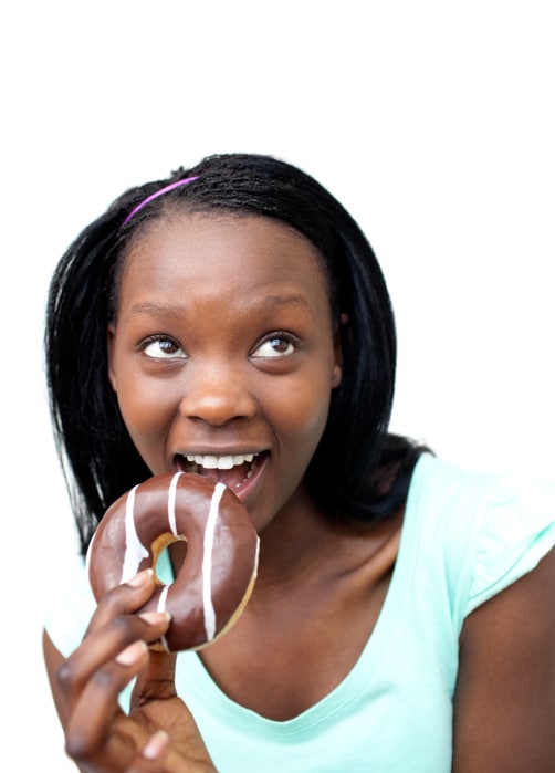 African American teen girl eating donut