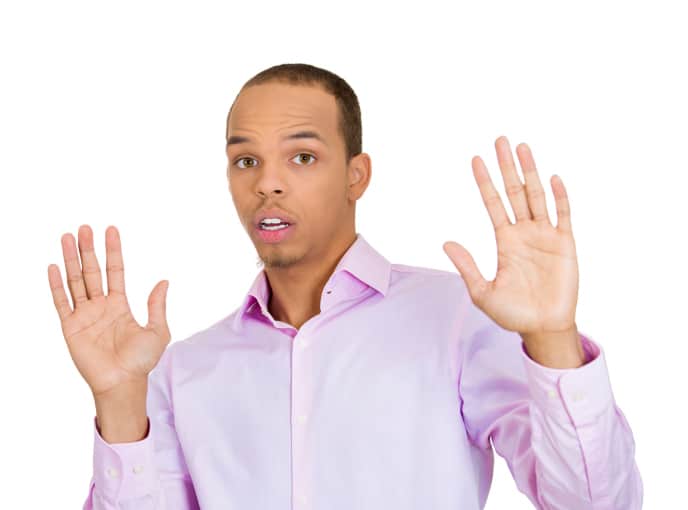 African American man hands up dodging