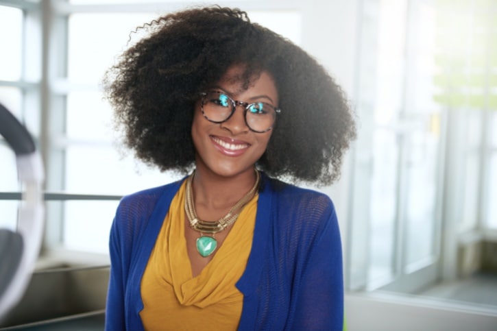 smiling woman with big curly natural hair