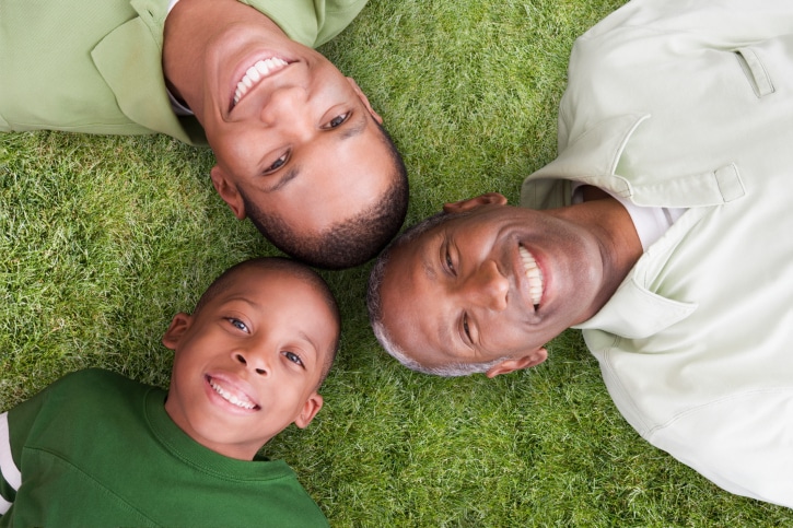 African American 3 generations father grandfather son outside