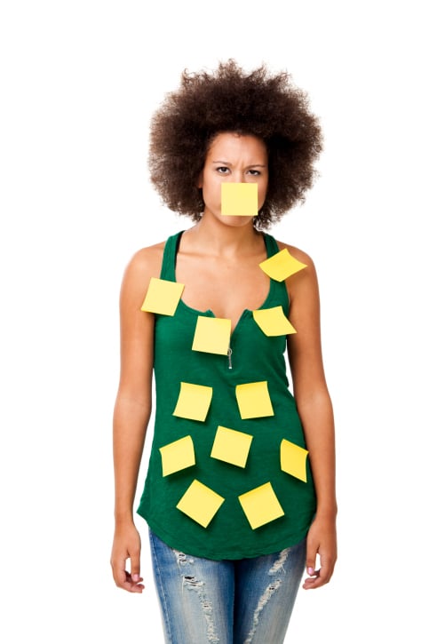 African American woman forgetful Post It Notes all over