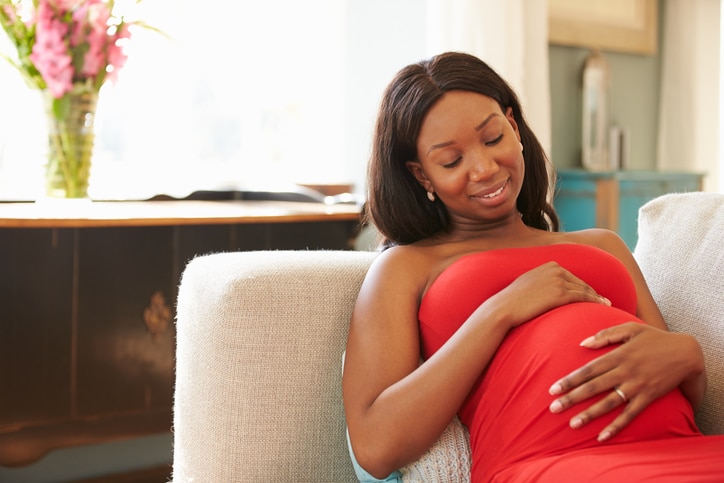African American pregnant woman relaxing