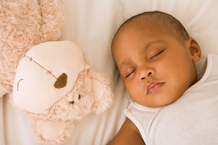 African American baby sleeping on back