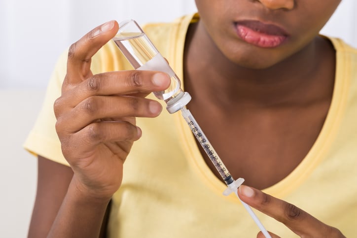 African American woman with syringe