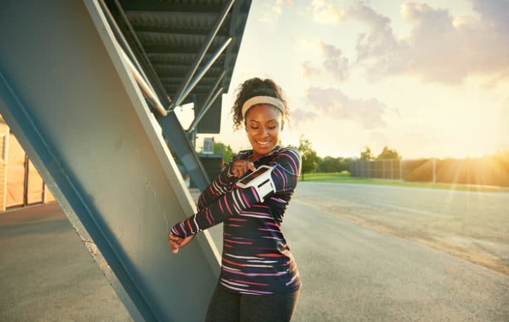 African American woman exercising outside