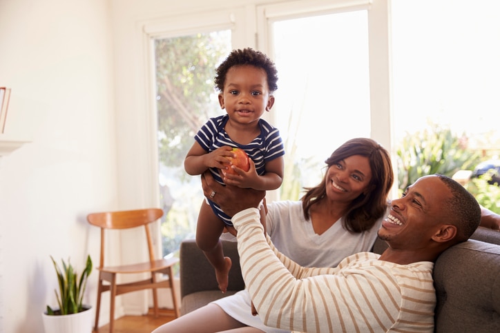 African American parents with happy baby