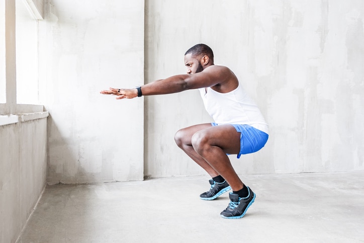 African American man exercise squat