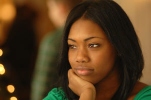 Black girl staring at something. 