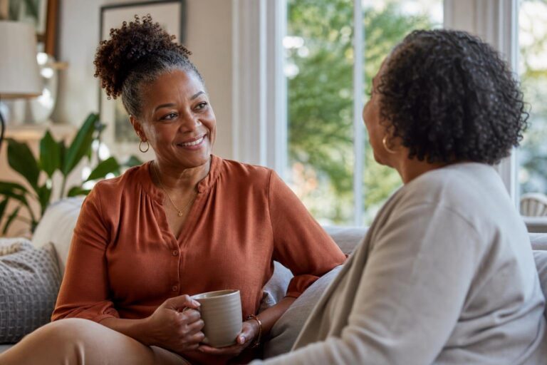 Black woman receives support after a double mastectomy at home.